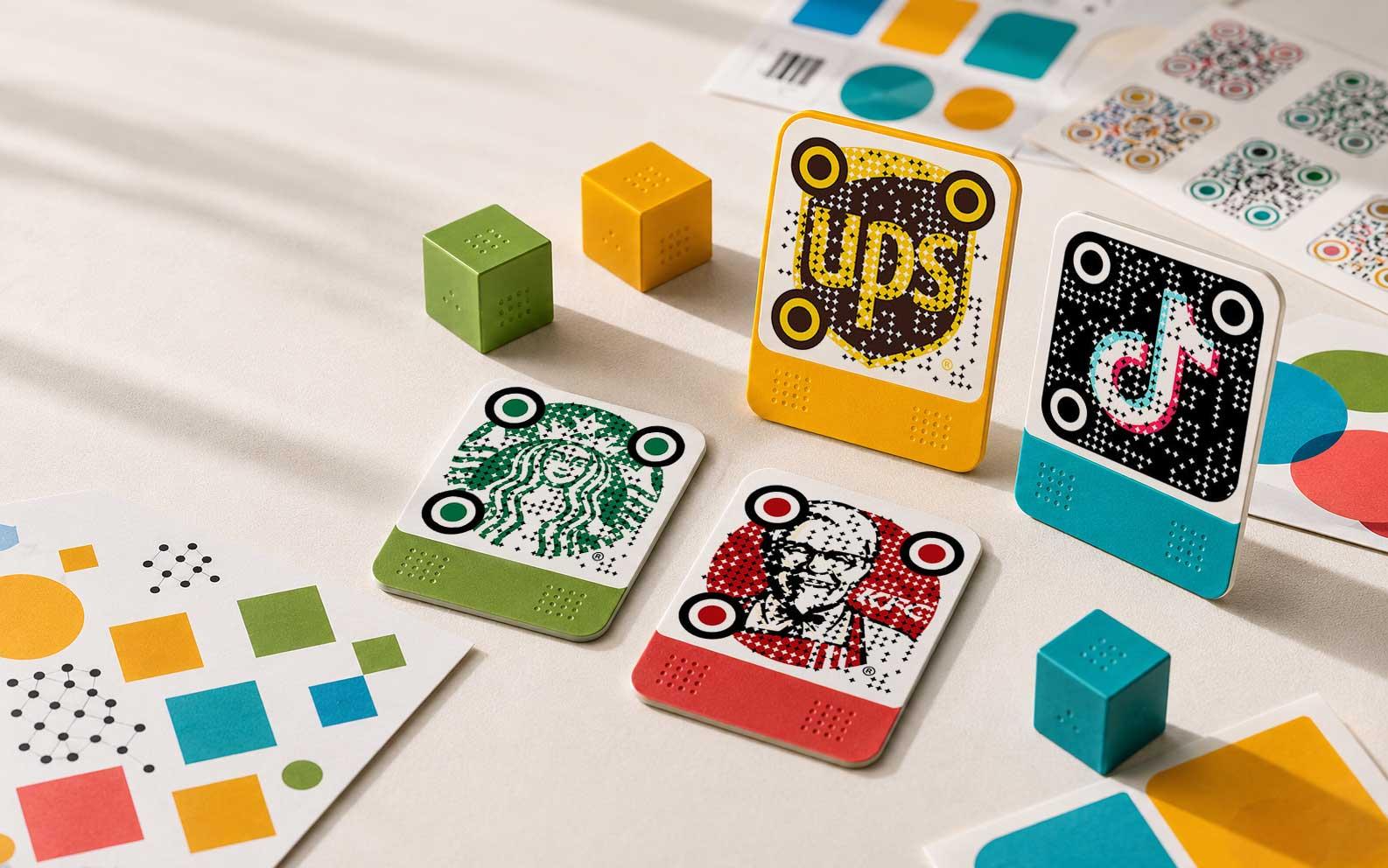 Premium branded QR cards arranged in a bright design studio scene
